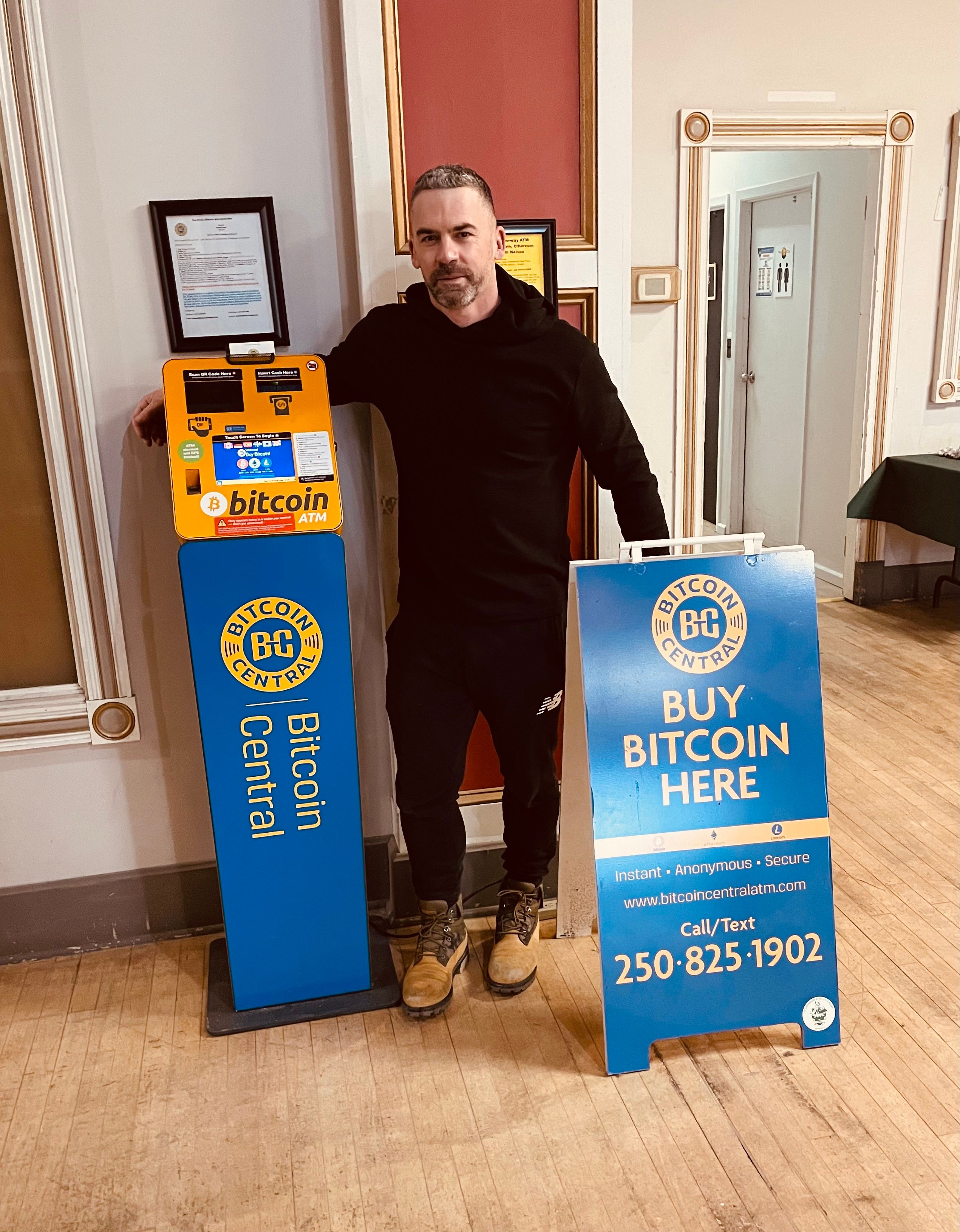 Ben Glickman, CEO of Bitcoin Central, with one of the company's ATMs in Nelson, BC