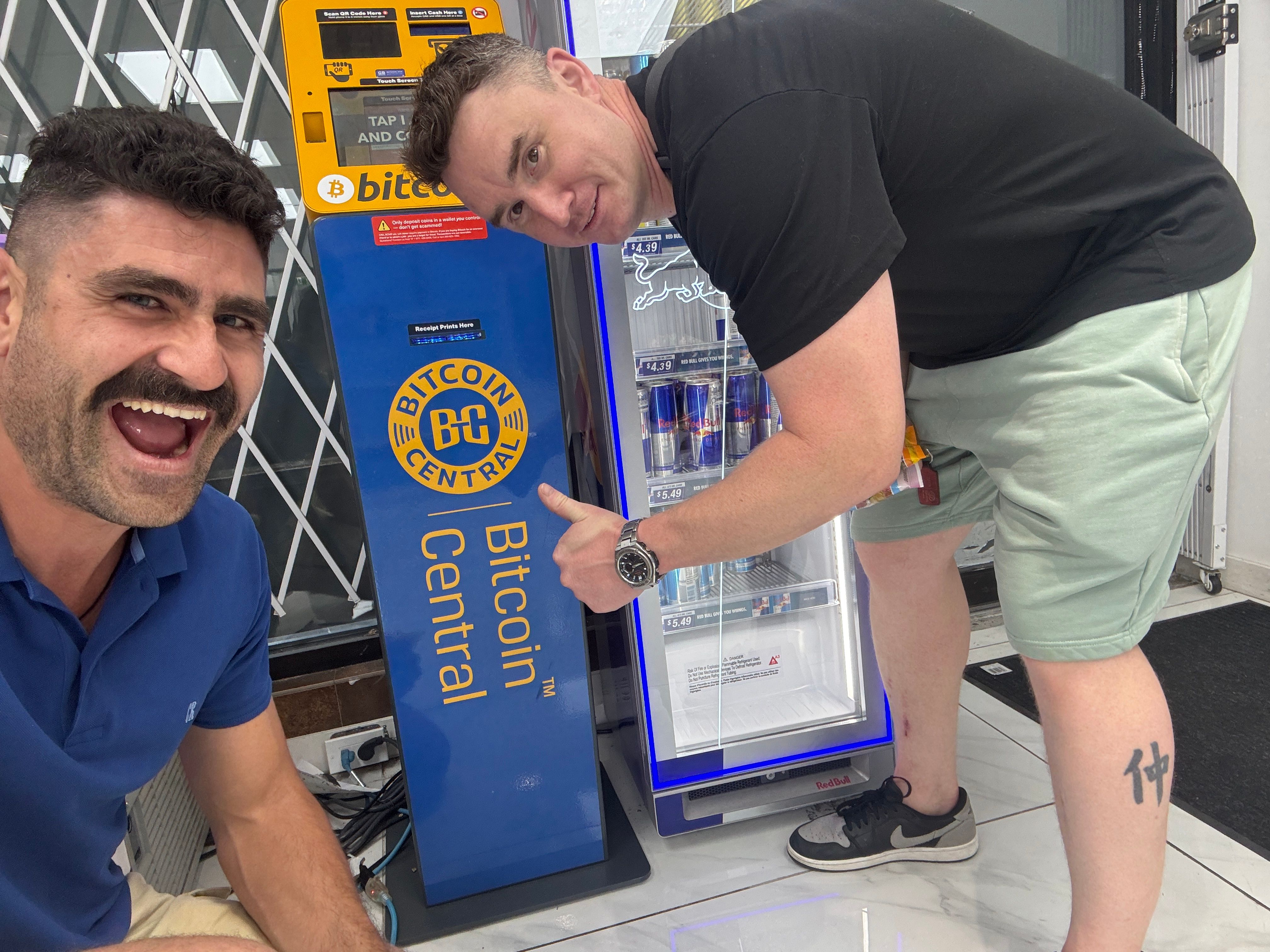 Two friends of Ben Glickman with a Bitcoin Central ATM in Kelowna, BC